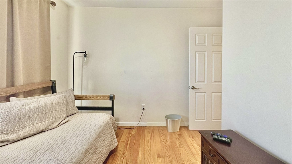 10 Milton Ridge Road, Unit 10 Lynn, MA 01902 - Photo 15 of 33 a bedroom with a bed and a window
