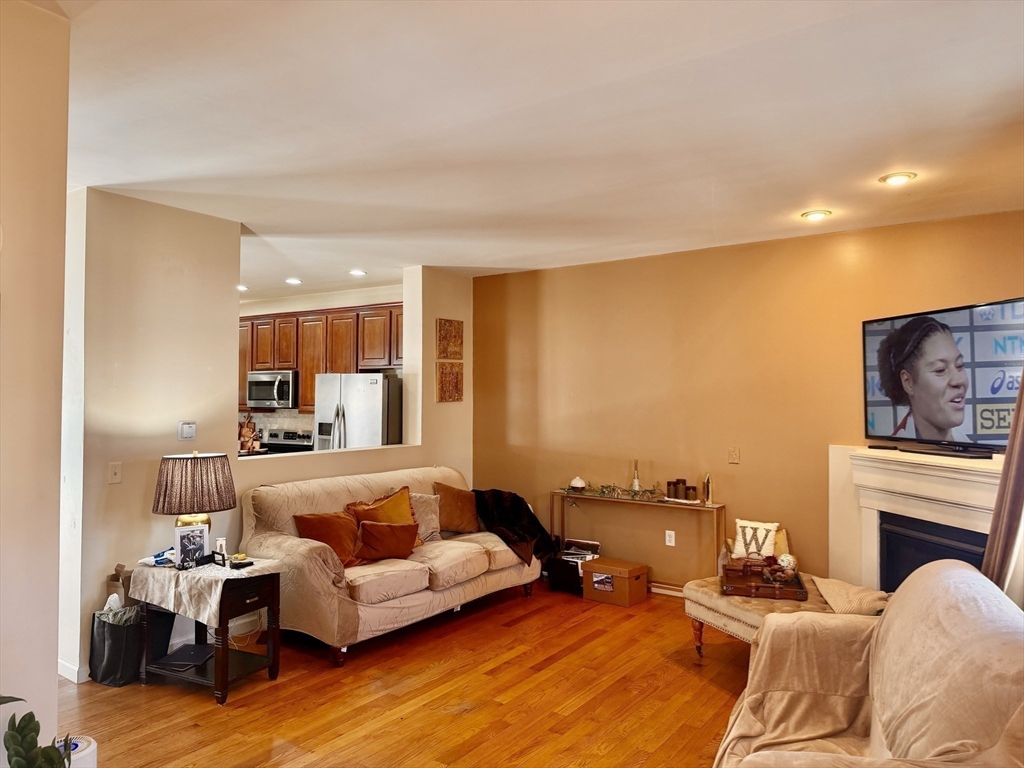 10 Milton Ridge Road, Unit 10 Lynn, MA 01902 - Photo 21 of 33 a bedroom with furniture and a fireplace