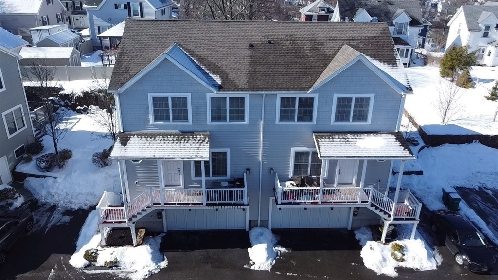 10 Milton Ridge Road, Unit 10 Lynn, MA 01902 - Photo 32 of 33 a front view of a house with a patio