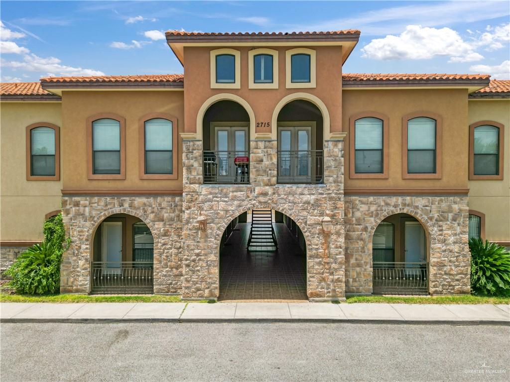 a front view of a house with yellow lighting