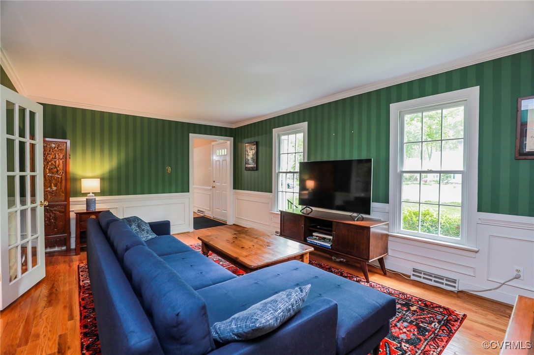 12830 Foxstone Road Midlothian, VA 23113 - Photo 11 of 42 a living room with furniture and a flat screen tv