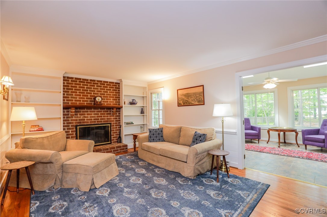 12830 Foxstone Road Midlothian, VA 23113 - Photo 14 of 42 a living room with furniture or couch and a fireplace