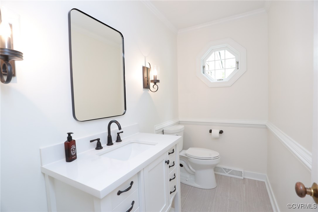12830 Foxstone Road Midlothian, VA 23113 - Photo 19 of 42 a bathroom with a toilet sink and mirror