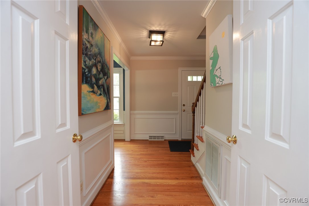 12830 Foxstone Road Midlothian, VA 23113 - Photo 2 of 42 a view of a hallway with wooden floor and staircase