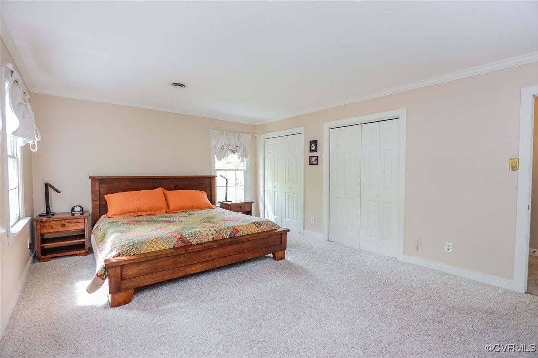 12830 Foxstone Road Midlothian, VA 23113 - Photo 21 of 42 a bedroom with a bed and a window