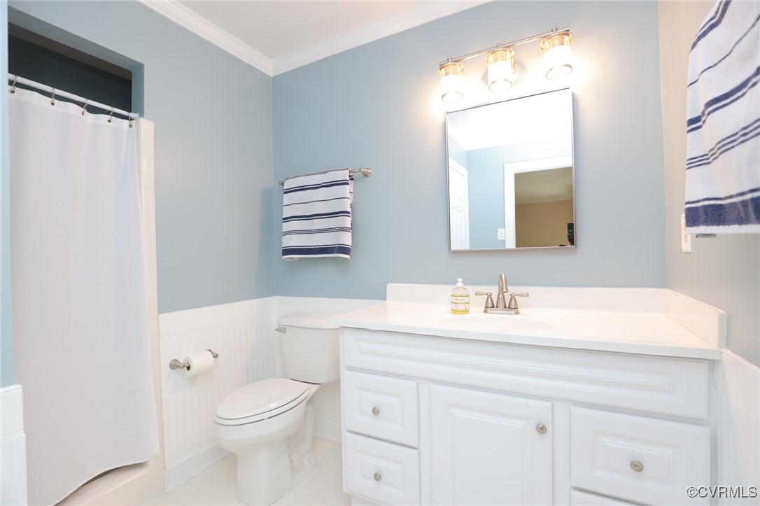12830 Foxstone Road Midlothian, VA 23113 - Photo 23 of 42 a bathroom with a toilet a sink a vanity a mirror and bathtub
