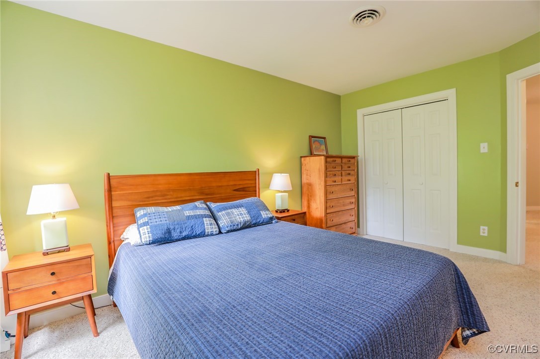 12830 Foxstone Road Midlothian, VA 23113 - Photo 26 of 42 a bedroom with a bed and lamps