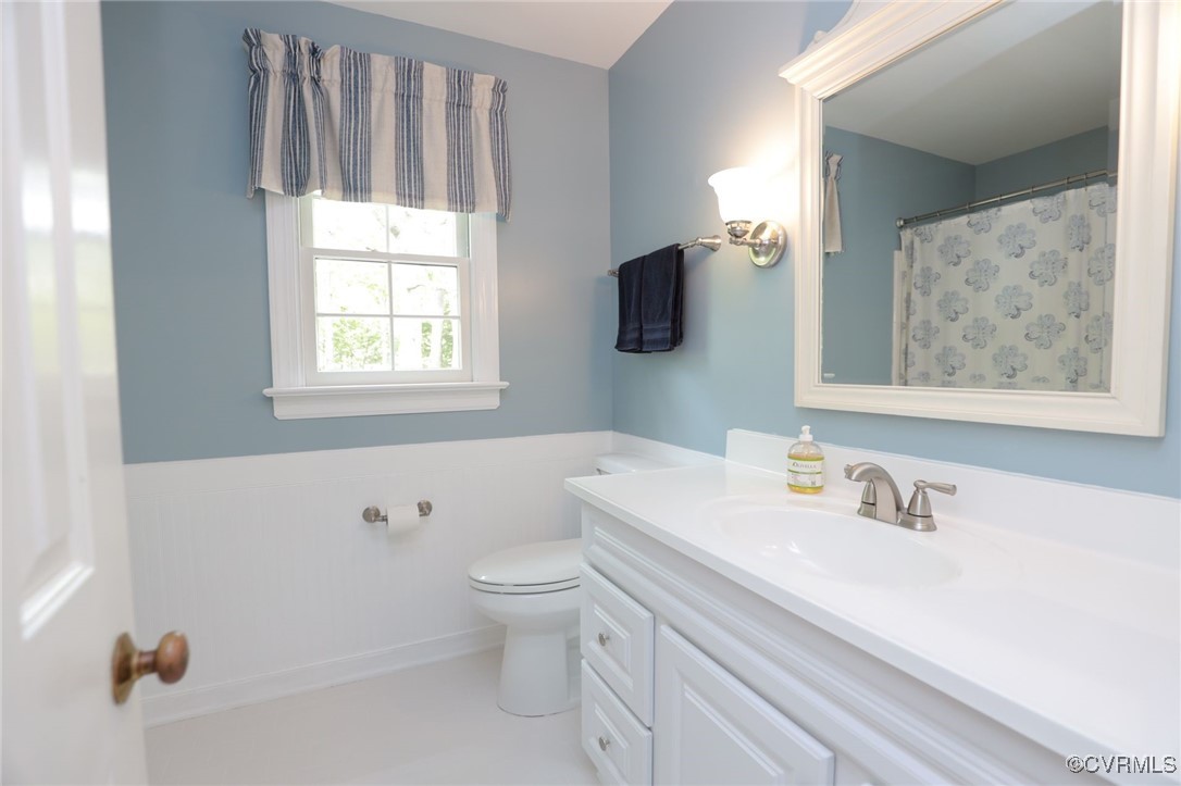 12830 Foxstone Road Midlothian, VA 23113 - Photo 34 of 42 a bathroom with a sink toilet and vanity