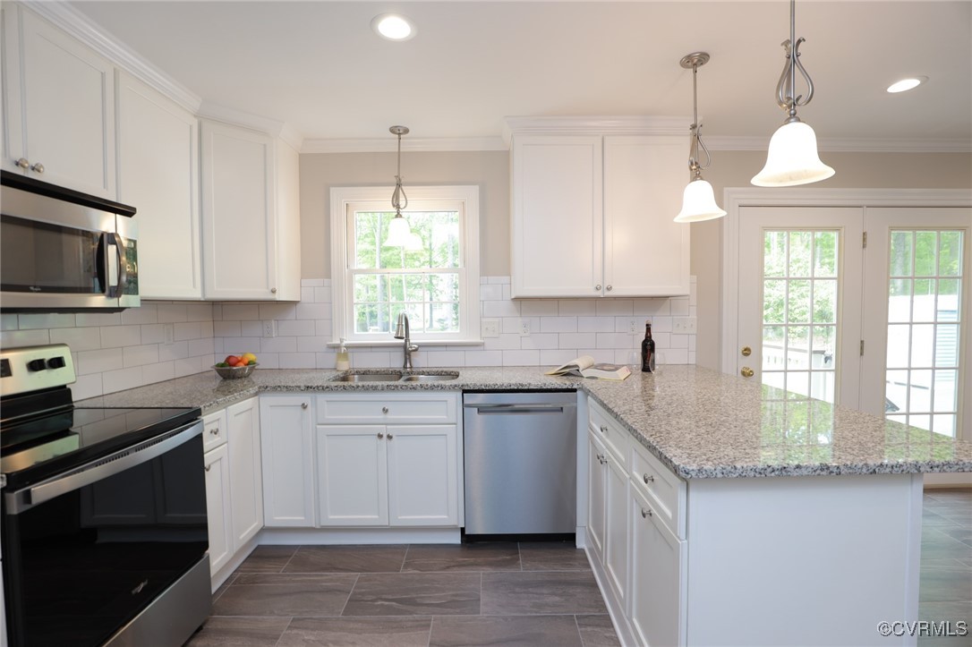 12830 Foxstone Road Midlothian, VA 23113 - Photo 4 of 42 a kitchen with a sink stove cabinets and window