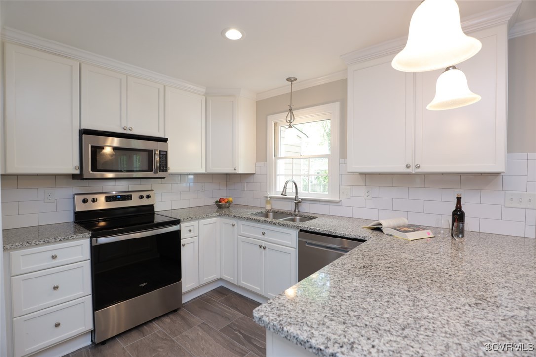 12830 Foxstone Road Midlothian, VA 23113 - Photo 5 of 42 a kitchen with a sink stove and microwave