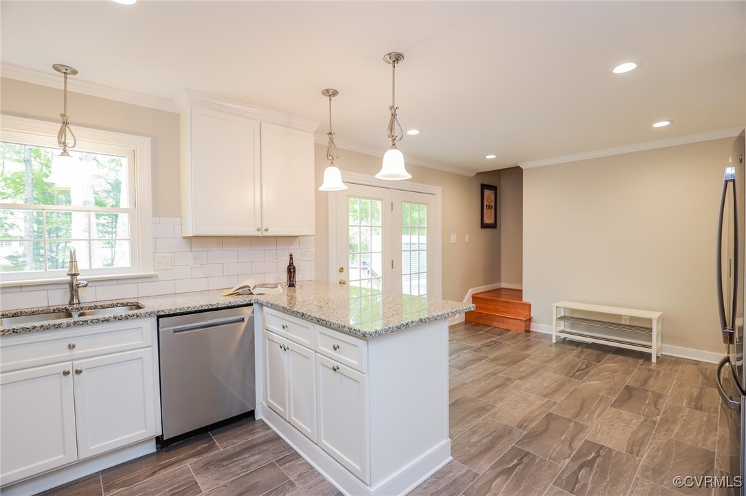 12830 Foxstone Road Midlothian, VA 23113 - Photo 8 of 42 a kitchen with stainless steel appliances granite countertop a sink a stove a refrigerator and white cabinets with wooden floor