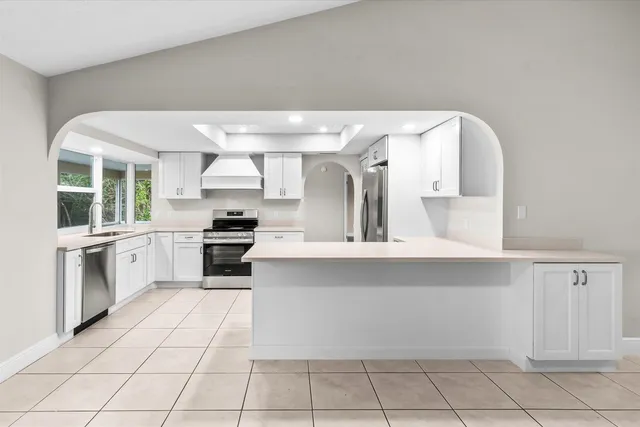 a kitchen with a cabinets and appliances
