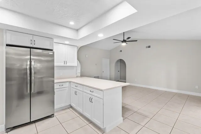 a kitchen with a refrigerator a sink and dishwasher