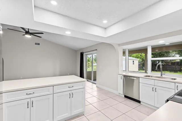 a kitchen with a sink and cabinets