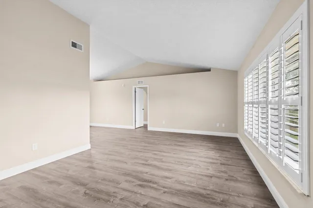 a view of an empty room with a window