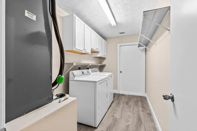 a view of storage and utility room with a sink
