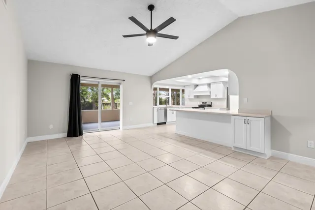 a view of a kitchen with a sink and a window