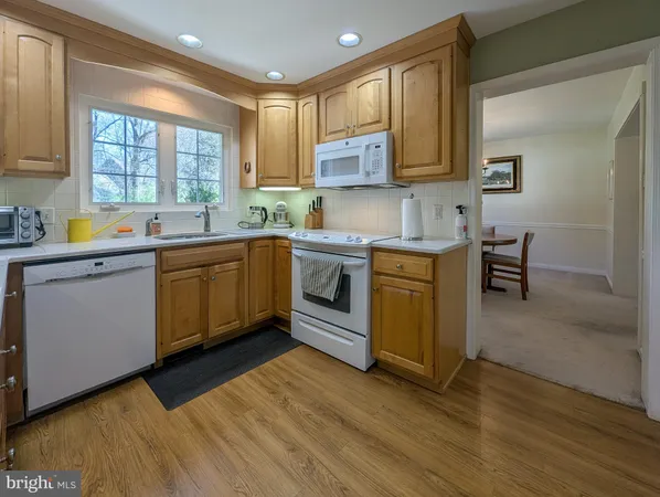 a kitchen with a sink cabinets and window