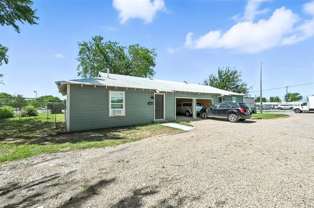 a car parked in front of a house