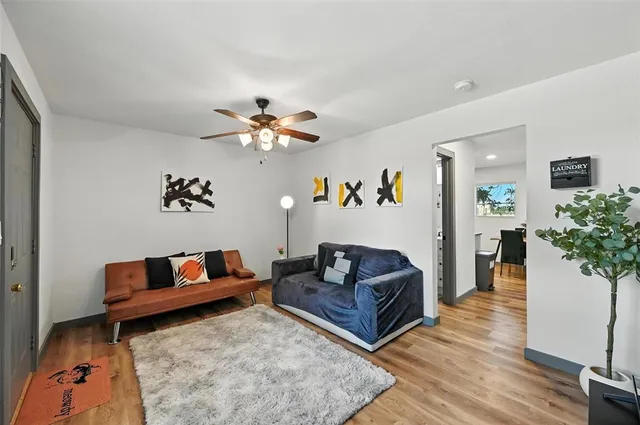 a backyard of a house with table and chairs