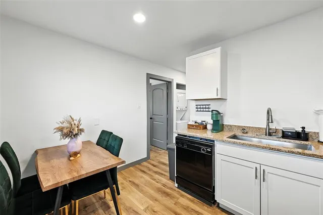 a kitchen with a sink stove and refrigerator