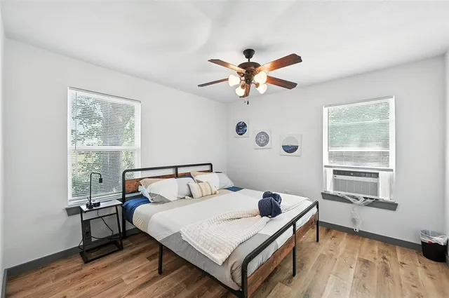 a bedroom with a bed and a window