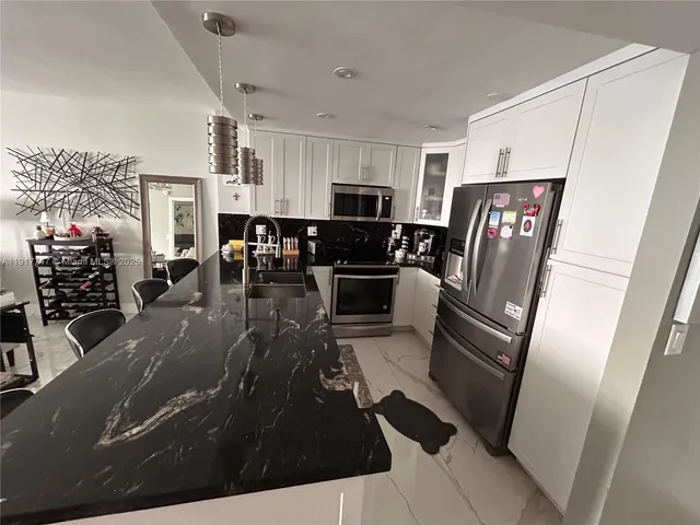 a bedroom with bed and window