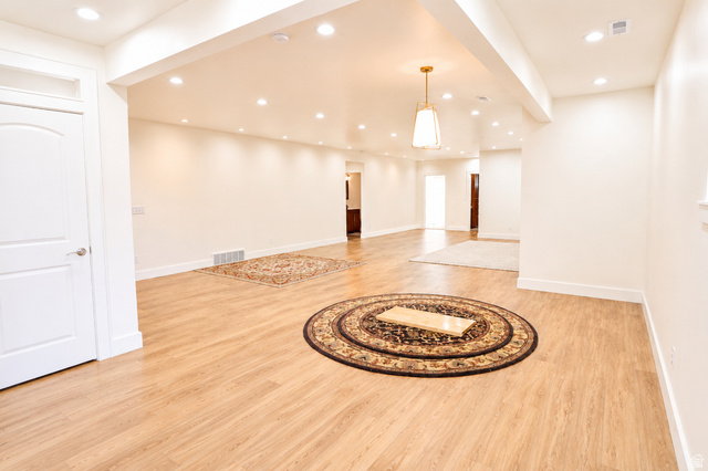 1055 North 1000 East Mapleton, UT 84664 - Photo 56 of 112 Expansive open-concept living space featuring wood-finish flooring and recessed lighting throughout