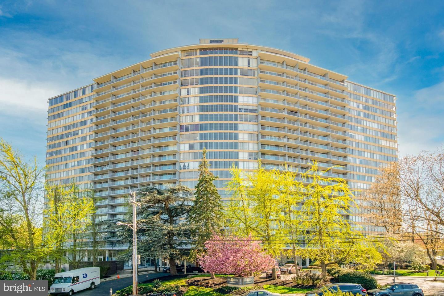 3900 West Ford Road, Unit 14K Philadelphia, PA 19131 - Photo 2 of 53 Modern high-rise with lush greenery.