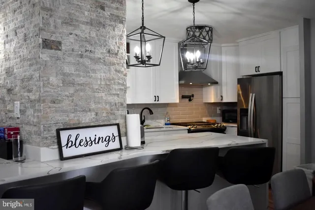 a view of swimming pool with outdoor seating