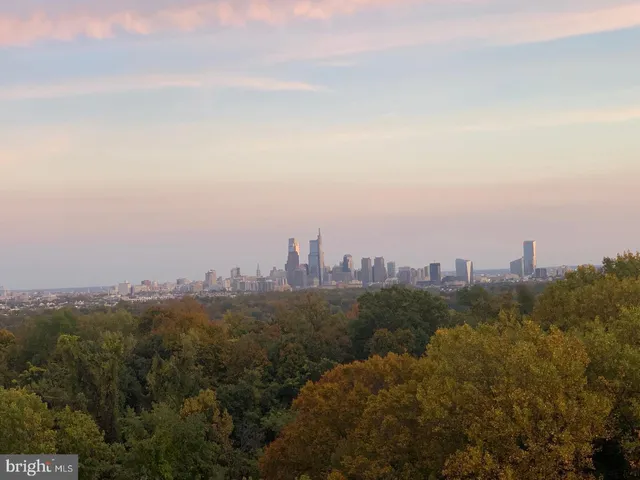 a view of a table and chairs under an umbrella
