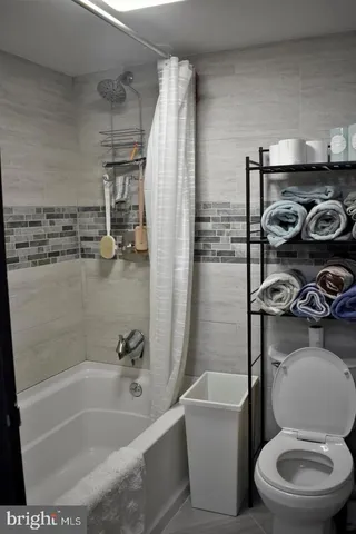 a view of a living room and a balcony