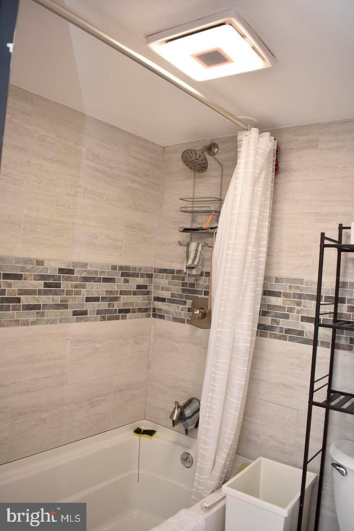 3900 West Ford Road, Unit 14K Philadelphia, PA 19131 - Photo 30 of 53 Modern bathroom with stylish tile accents.