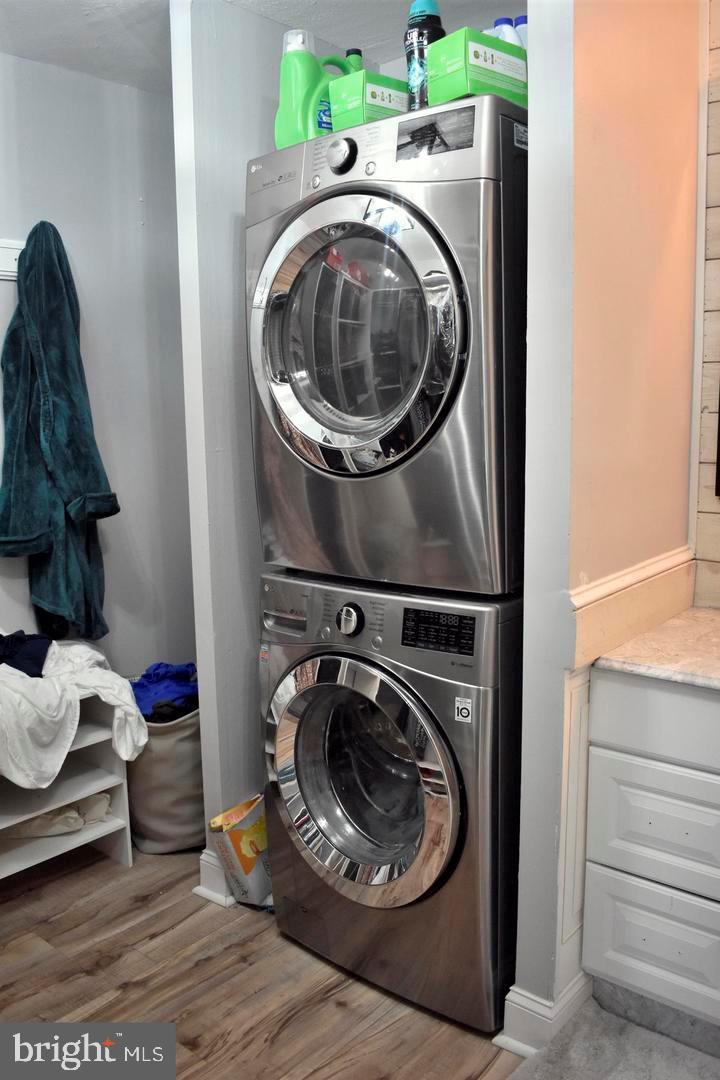 3900 West Ford Road, Unit 14K Philadelphia, PA 19131 - Photo 32 of 53 Sleek stacked laundry appliances in modern space.