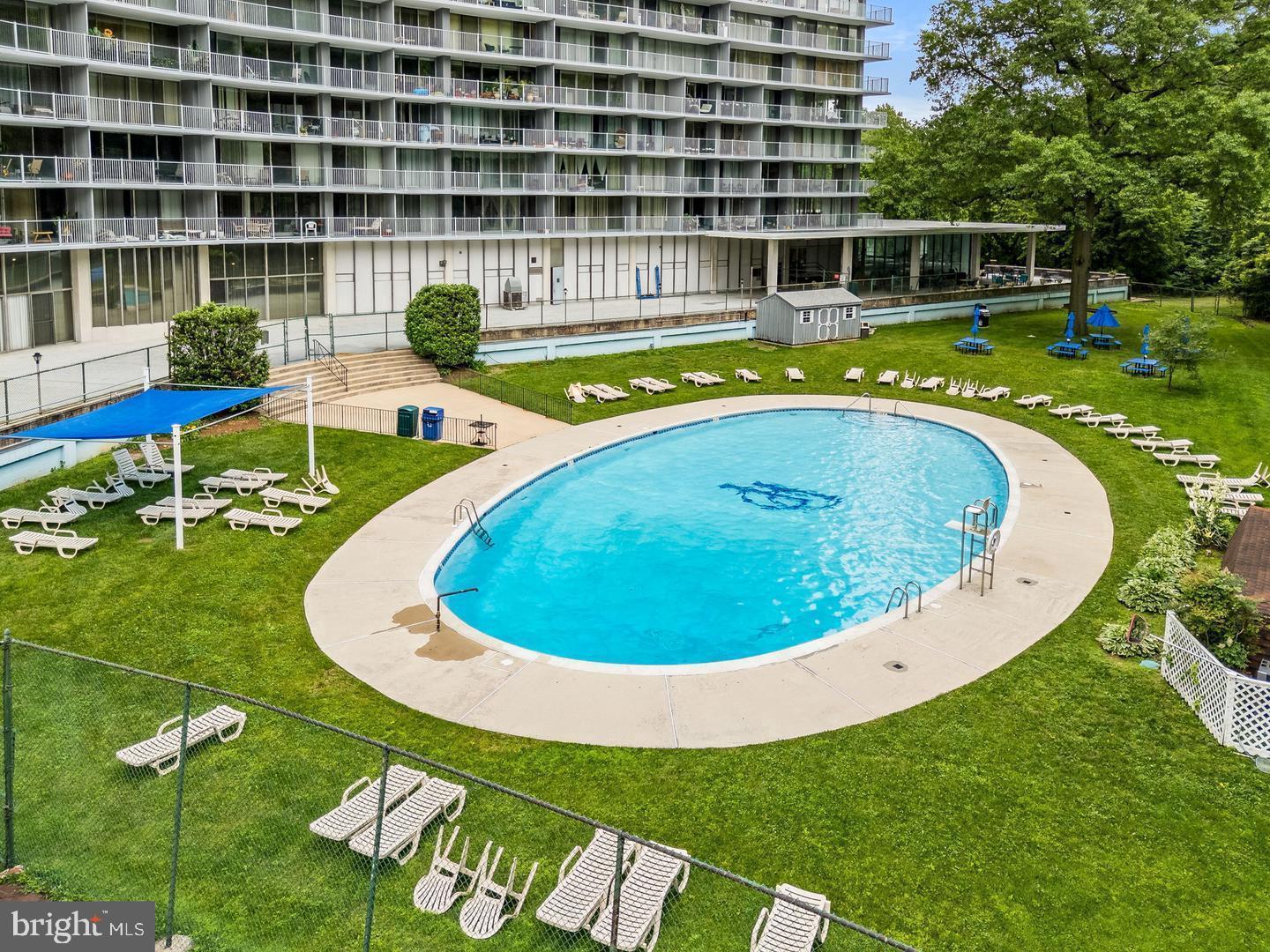 3900 West Ford Road, Unit 14K Philadelphia, PA 19131 - Photo 40 of 53 Serene poolside retreat in lush surroundings.
