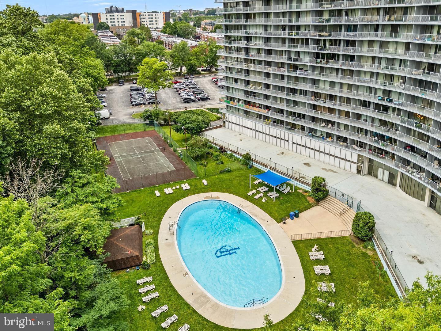 3900 West Ford Road, Unit 14K Philadelphia, PA 19131 - Photo 41 of 53 Serene poolside retreat in lush surroundings.