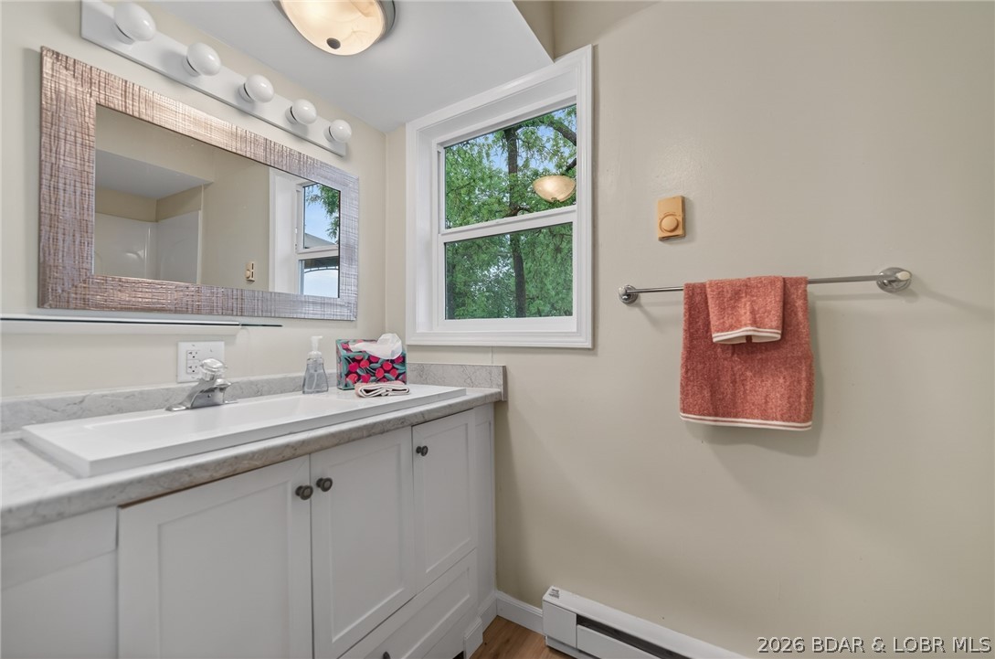 177 Storage Road Eldon, MO 65026 - Photo 26 of 34 In the common bathroom, function continues to meet