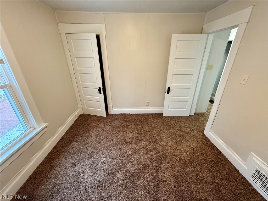 39 North Balch Street Akron, OH 44303 - Photo 17 of 19 Unfurnished room featuring dark carpet and baseboards