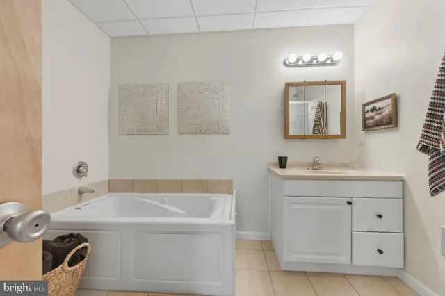 a bathroom with a sink a vanity and a mirror