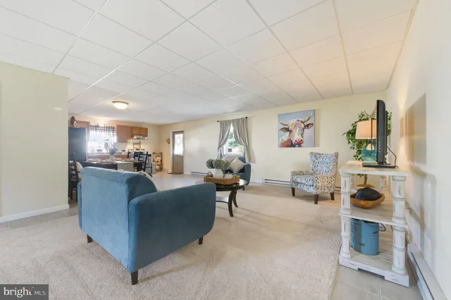 a living room with furniture and a table