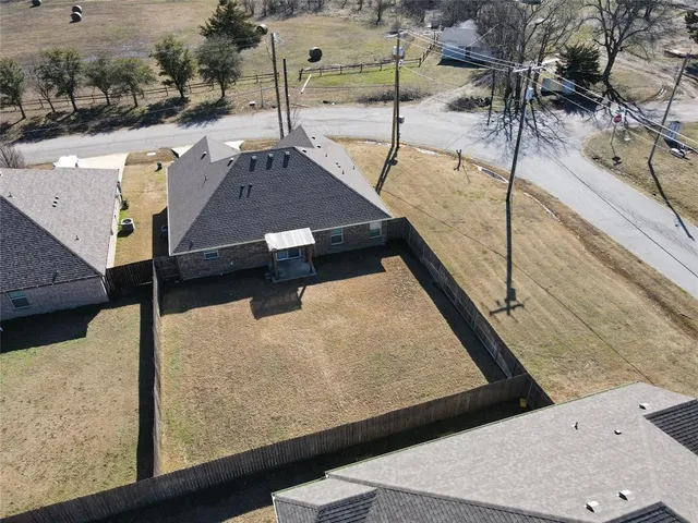 a view of a balcony with two chairs