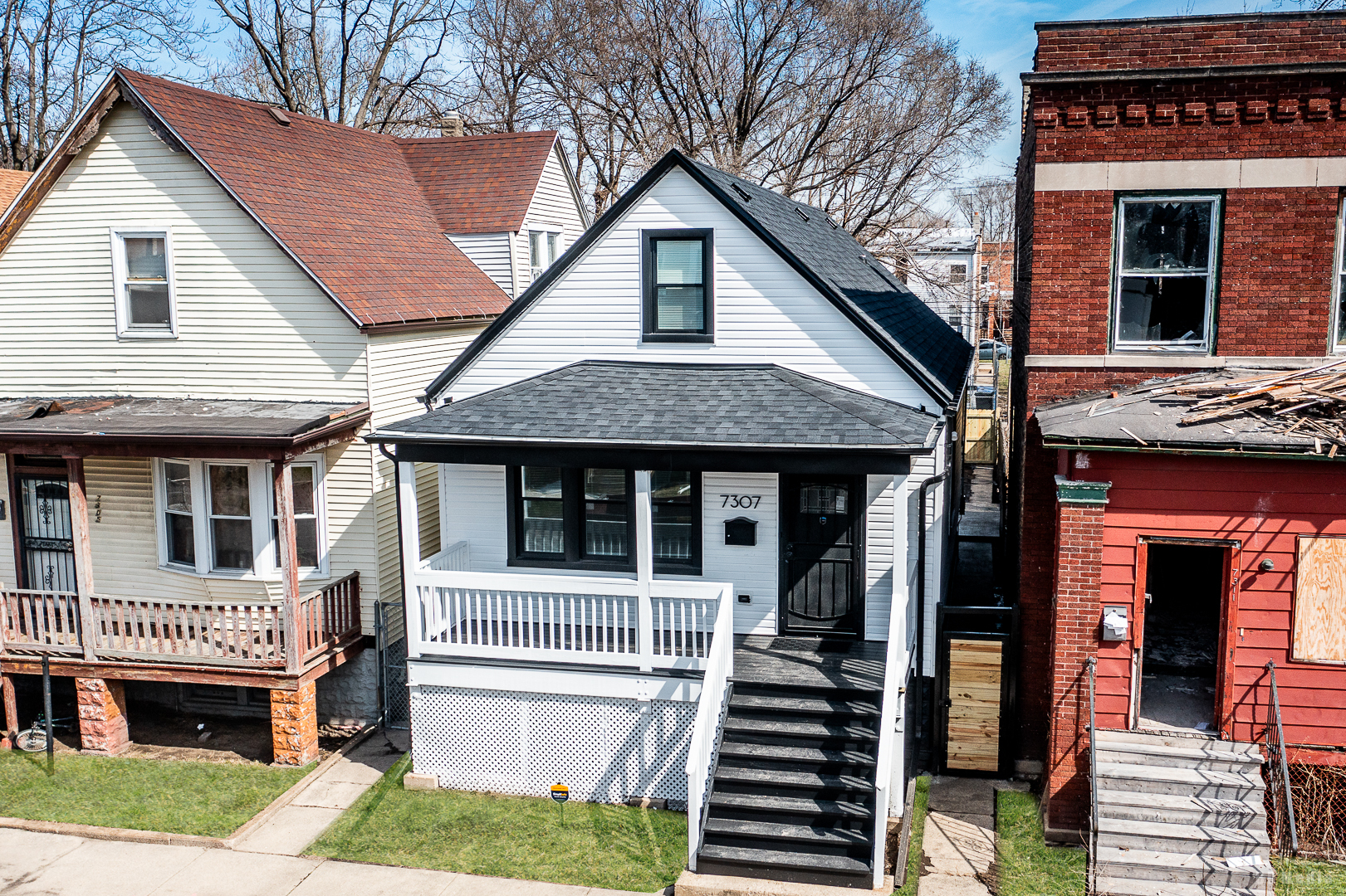 a front view of a house with a porch