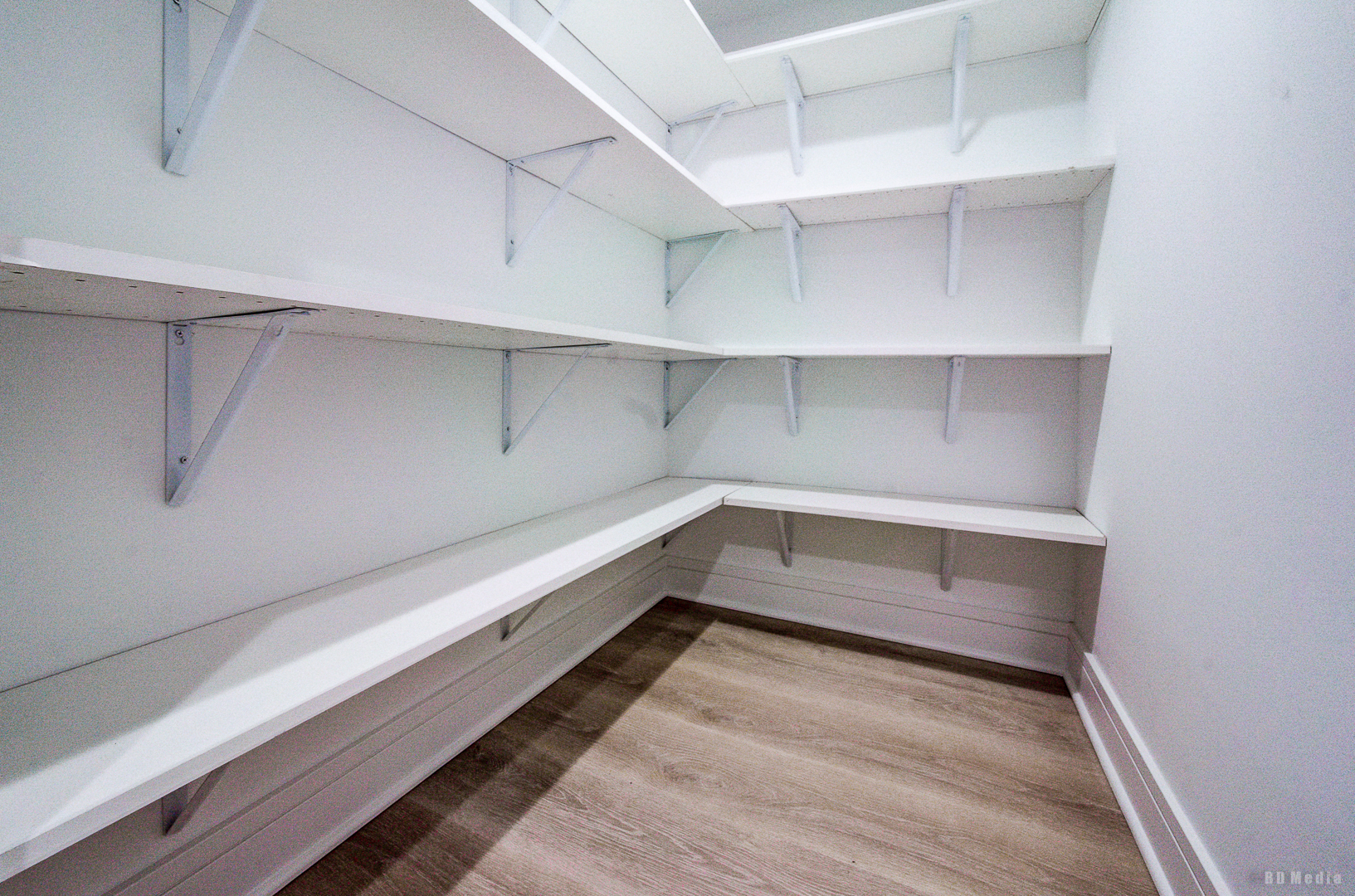 7307 South Peoria Street Chicago, IL 60621 - Photo 19 of 45 a storage room with empty racks