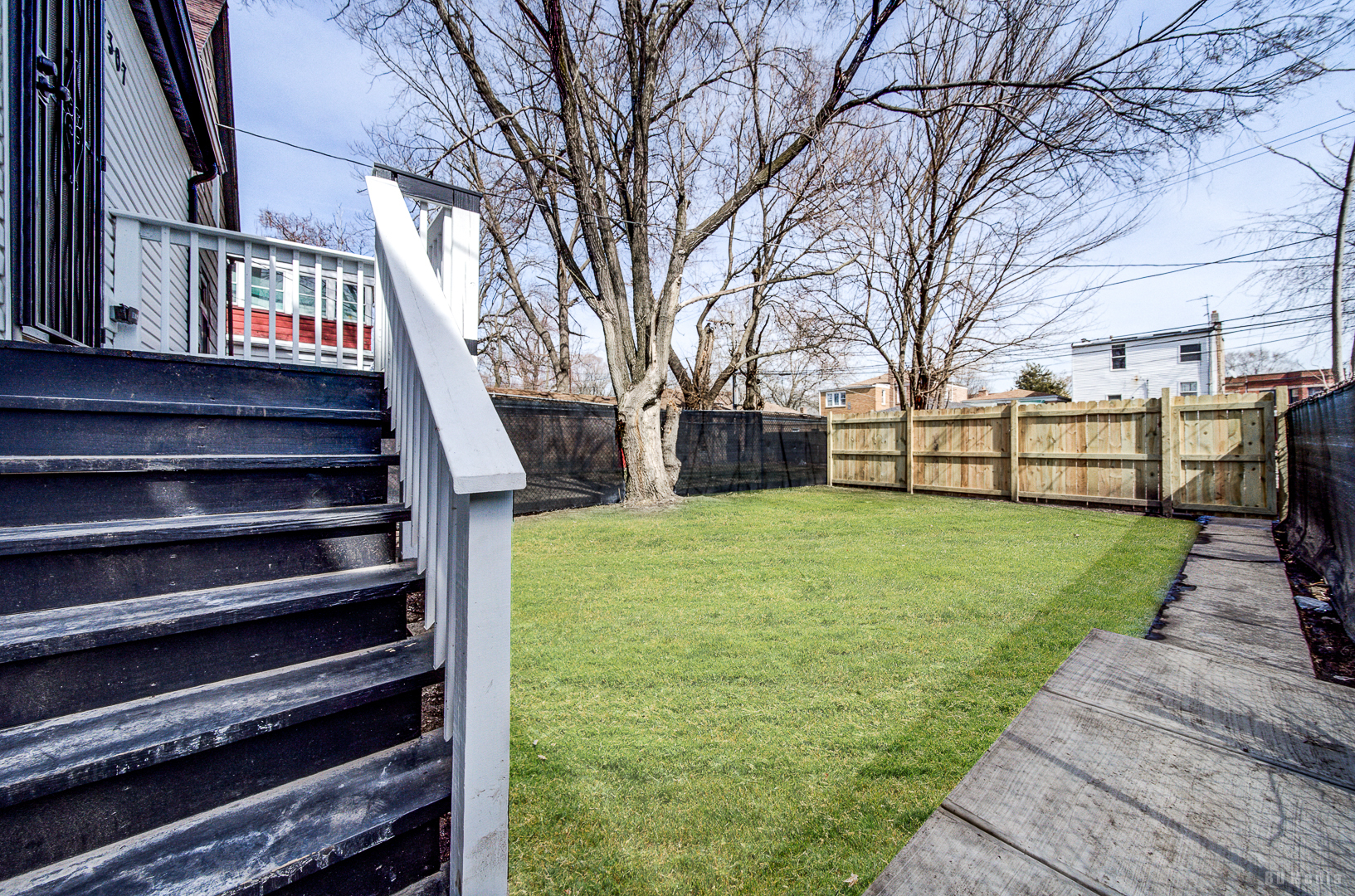7307 South Peoria Street Chicago, IL 60621 - Photo 34 of 45 a view of a garden with wooden bench