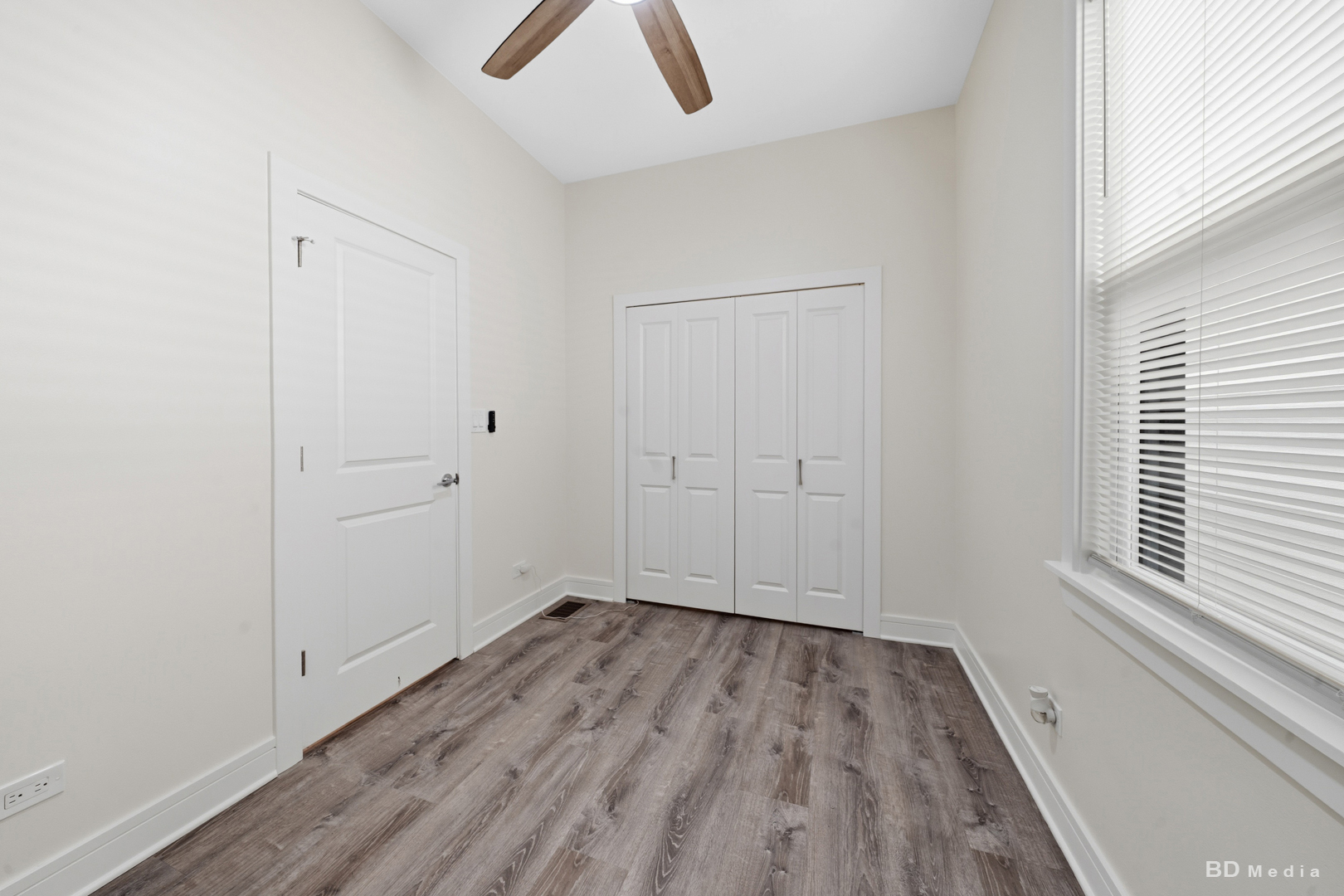 7307 South Peoria Street Chicago, IL 60621 - Photo 10 of 45 a view of room with hardwood floor and window