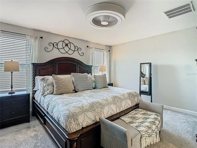 a view of walk in closet with clothes