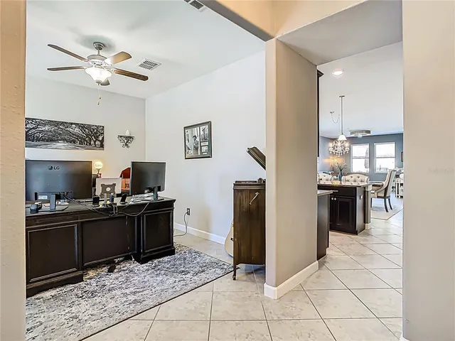 a kitchen with granite countertop a refrigerator and a stove