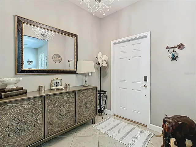 a bathroom with a toilet mirror and vanity