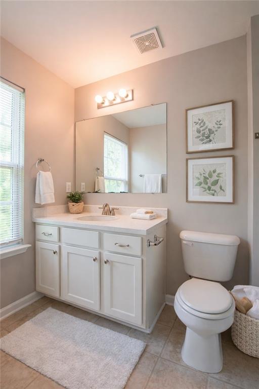 6764 Blackstone Place, Unit 6 Mableton, GA 30126 - Photo 4 of 5 a bathroom with a toilet sink and mirror
