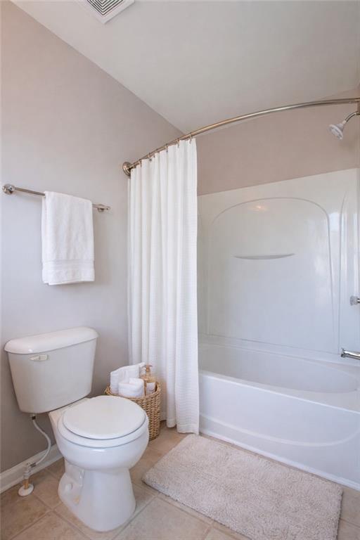 6764 Blackstone Place, Unit 6 Mableton, GA 30126 - Photo 5 of 5 a bathroom with a toilet a sink and shower